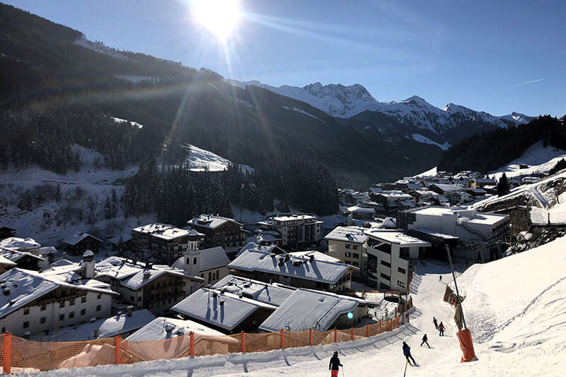 Ski slope behind our houses to the village cable car in Gerlos in winter